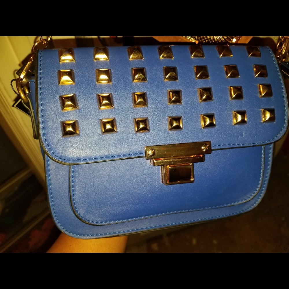 Blue cross body bag with gold studs